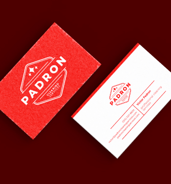 Image of two sets of business cards showing the front and back of the cards in red and white.