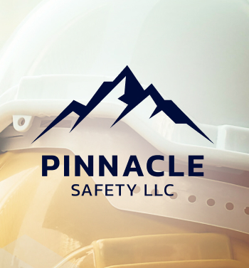 Image of Pinnacle's log in bleck with a yellow hard hat in the background.