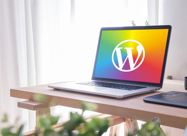 Computer on Desk with WordPress Logo
